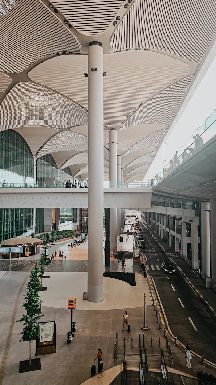 about-02 A spacious and modern airport terminal with striking architectural features and natural lighting.