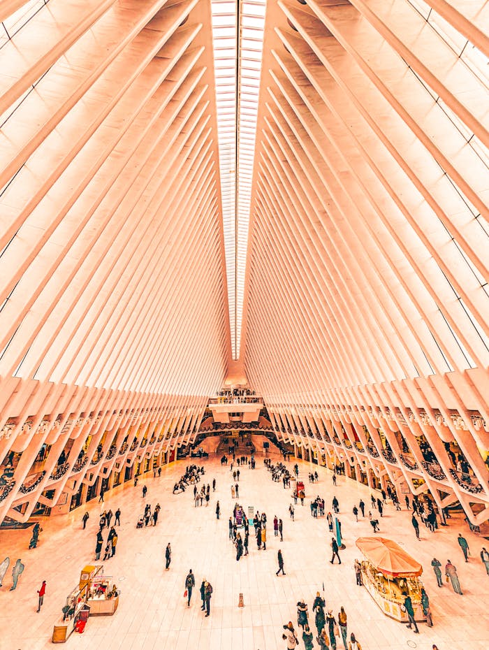 why-choose-us Vibrant view of the Oculus interior in New York City with people walking.